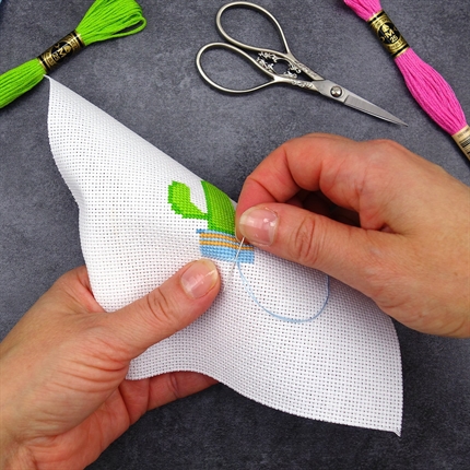 Person doing a cross stitch