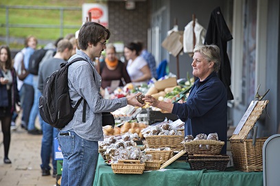 Student purchasing goods from a stall at Keele