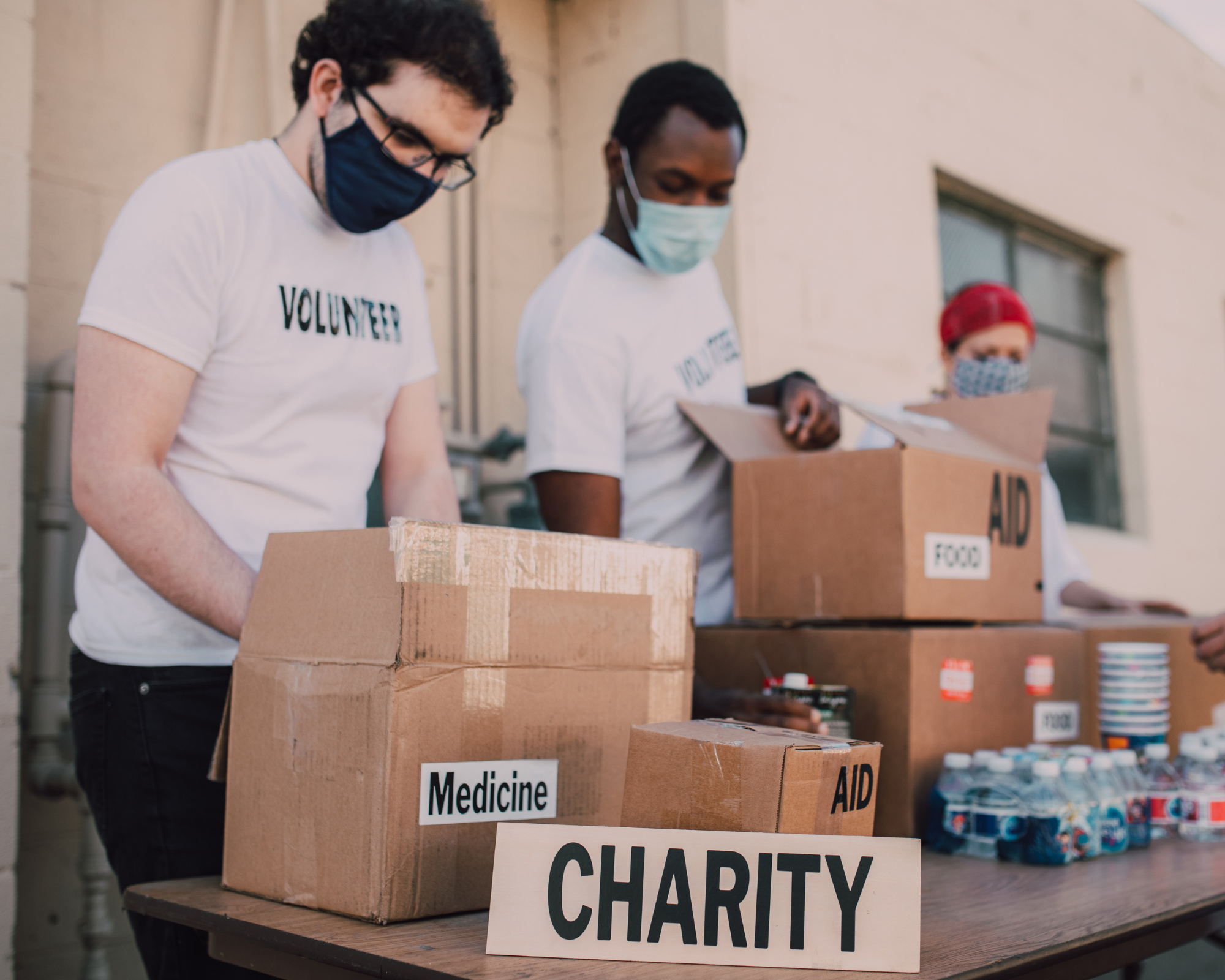 Image of volunteers packing boxes for charity