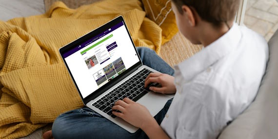 Student at laptop logging their Volunteering hours