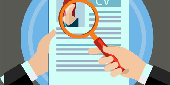 Hands holding a CV with a magnifying glass