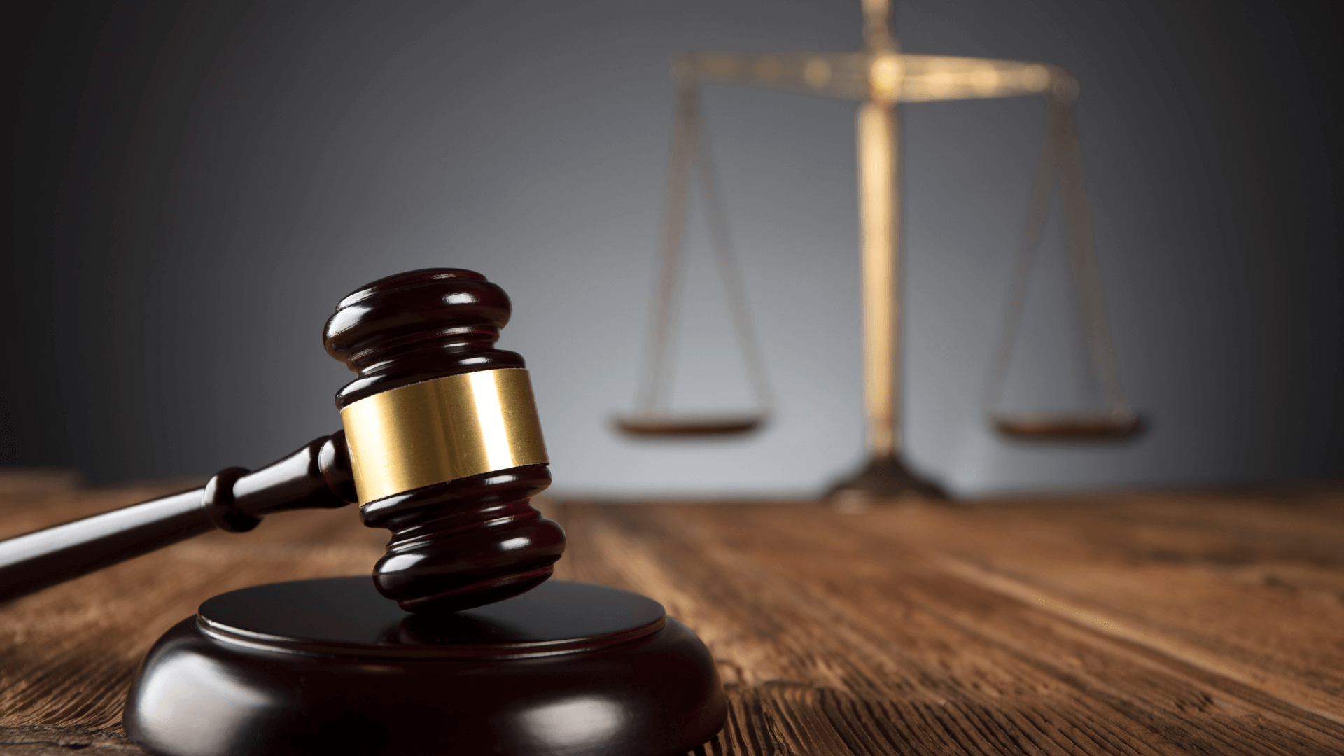 Judge's gavel with scales in background