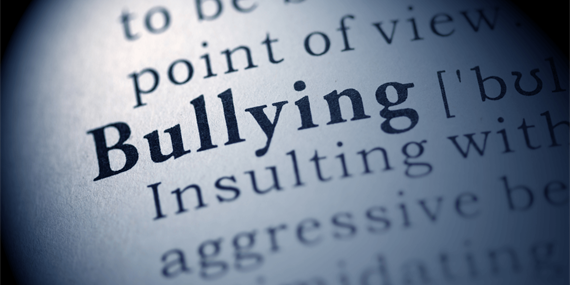 Bullying definition in a dictionary