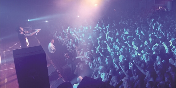 person on stage speaking to crown in Keele ballroom