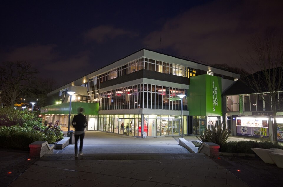 KeeleSU outside at night looking from forest of light