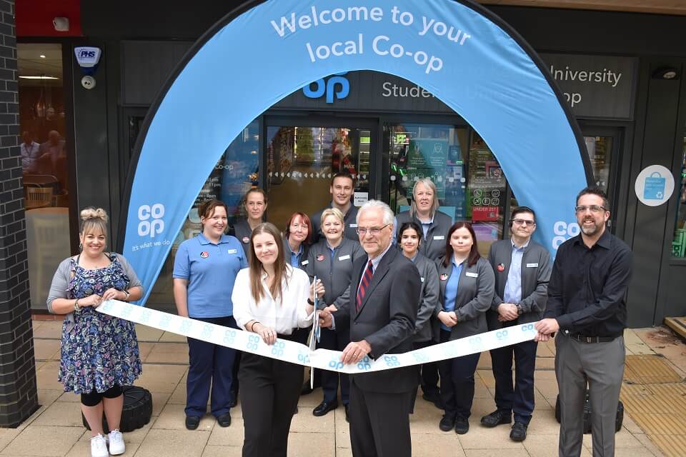 Co-op Launch, where the Vice Chancellor and members of Student Union Staff are cutting the ribbon