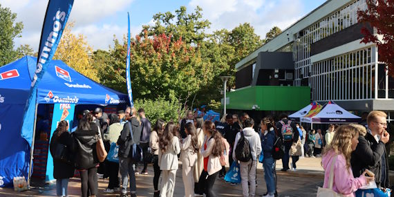 Students looking at stalls at a Freshers fair