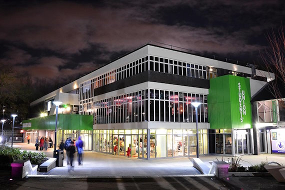 SU building lit up from the outside at night