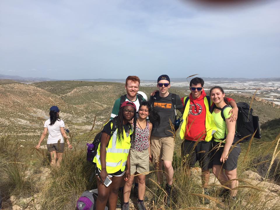 Geography Society Group Photo with members posing on a hilltop