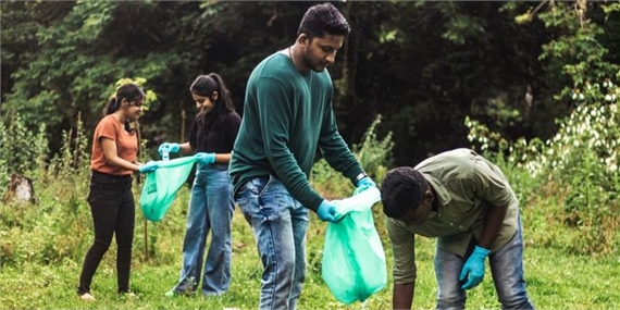 A group of Students litter-picking in the woods around Keele campus.