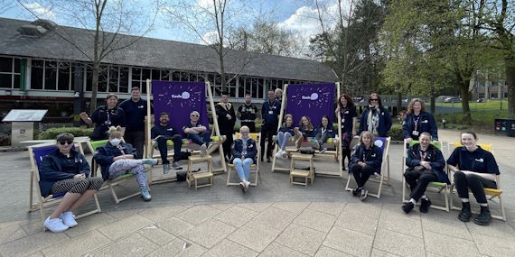 Some of the SU staff teams sitting on deckchairs outside the SU